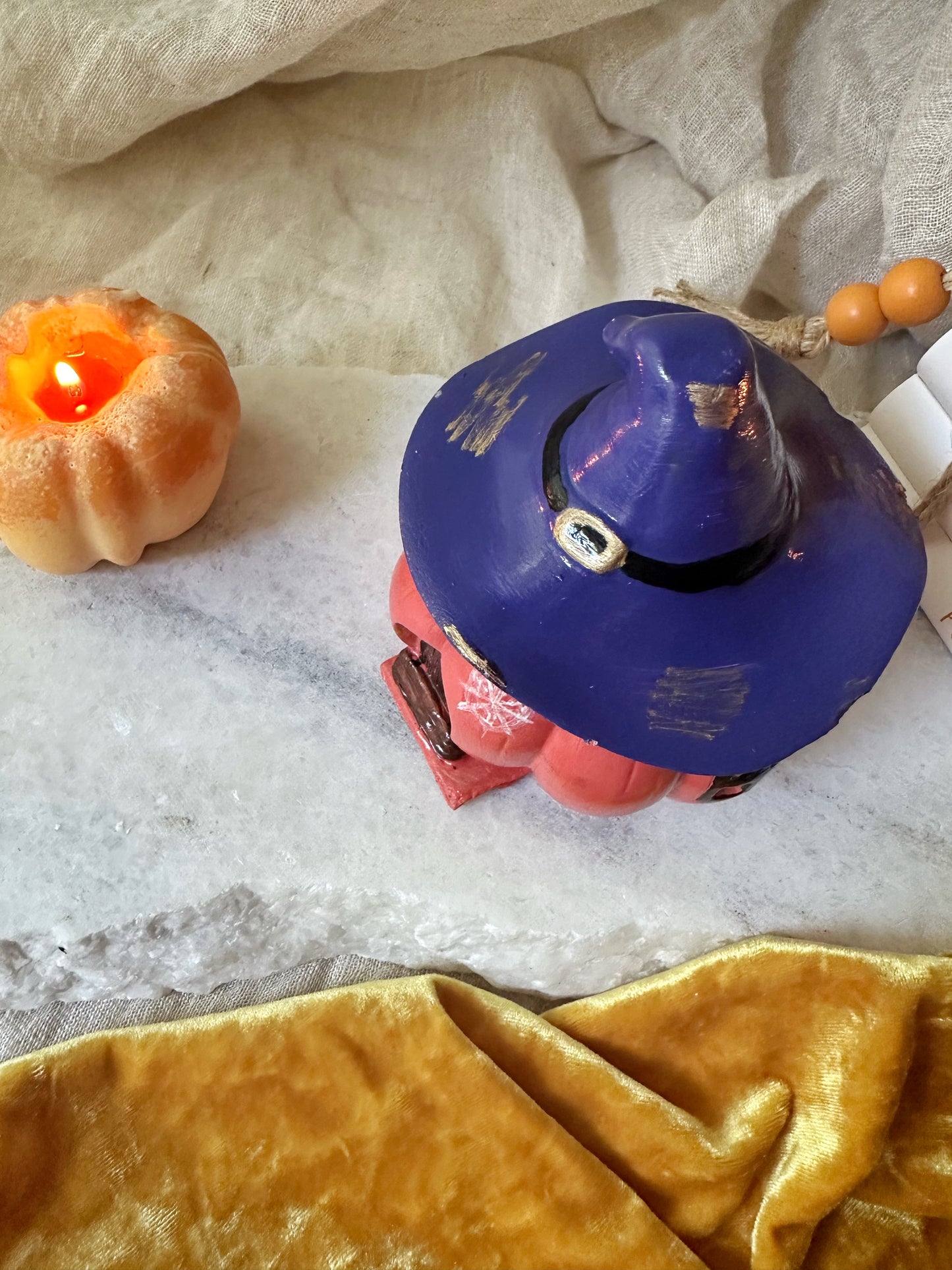 Pumpkin candle with witch hat