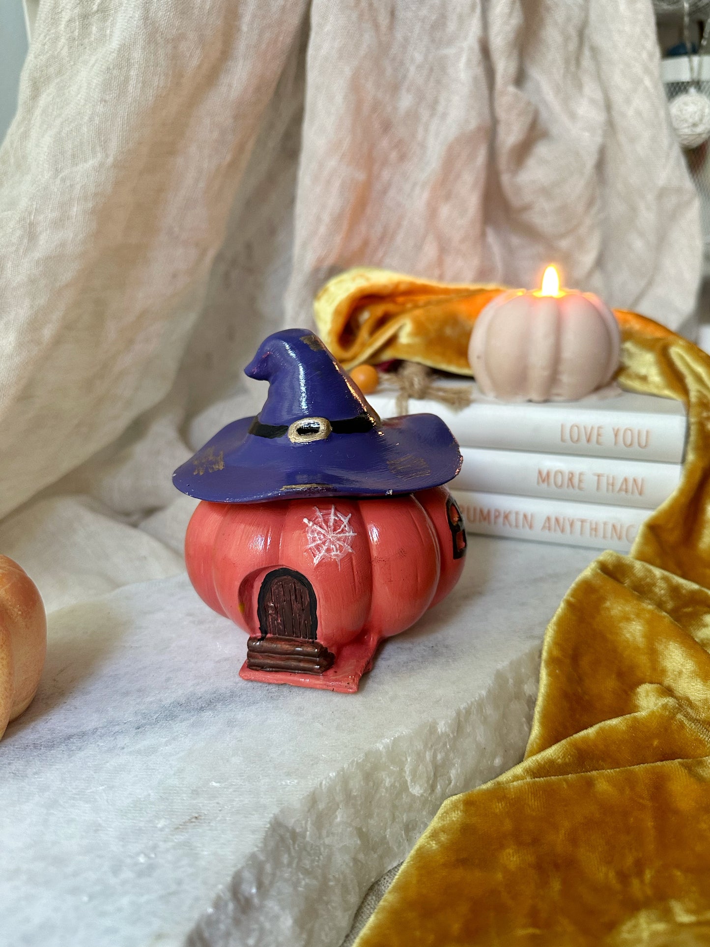Pumpkin candle with witch hat