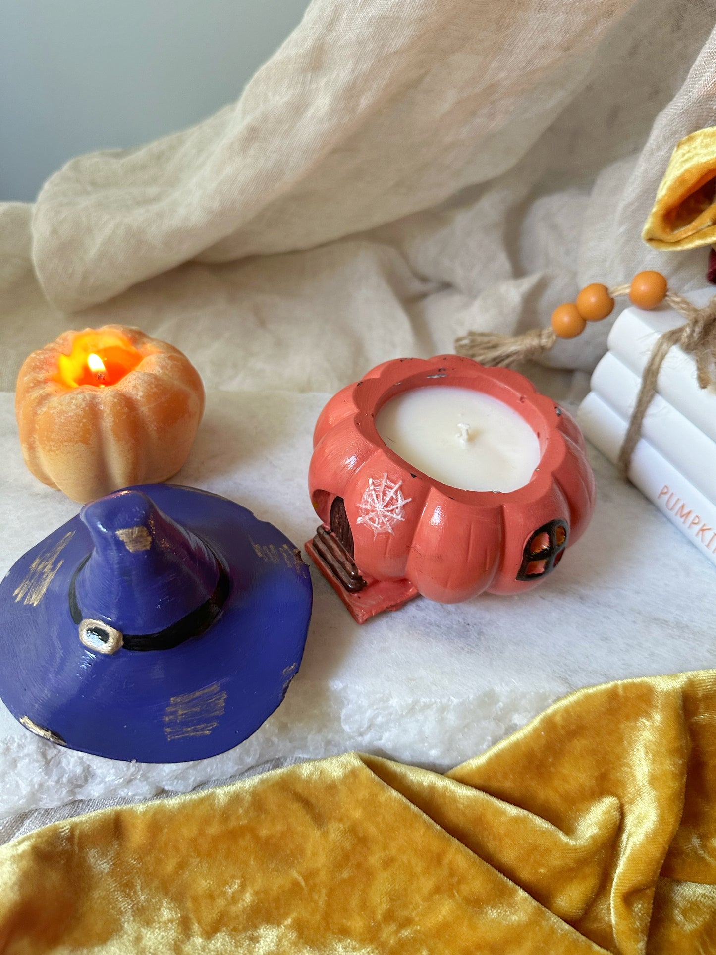 Pumpkin candle with witch hat