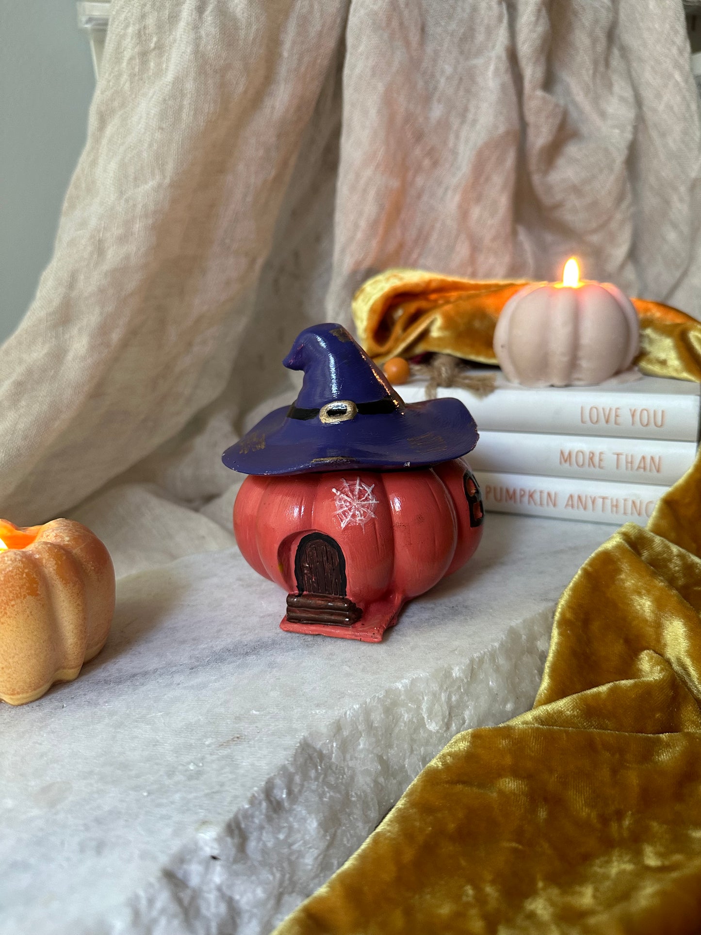 Pumpkin candle with witch hat
