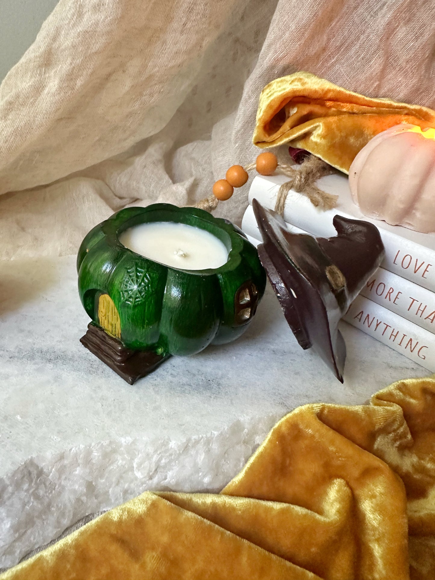 Pumpkin candle with witch hat